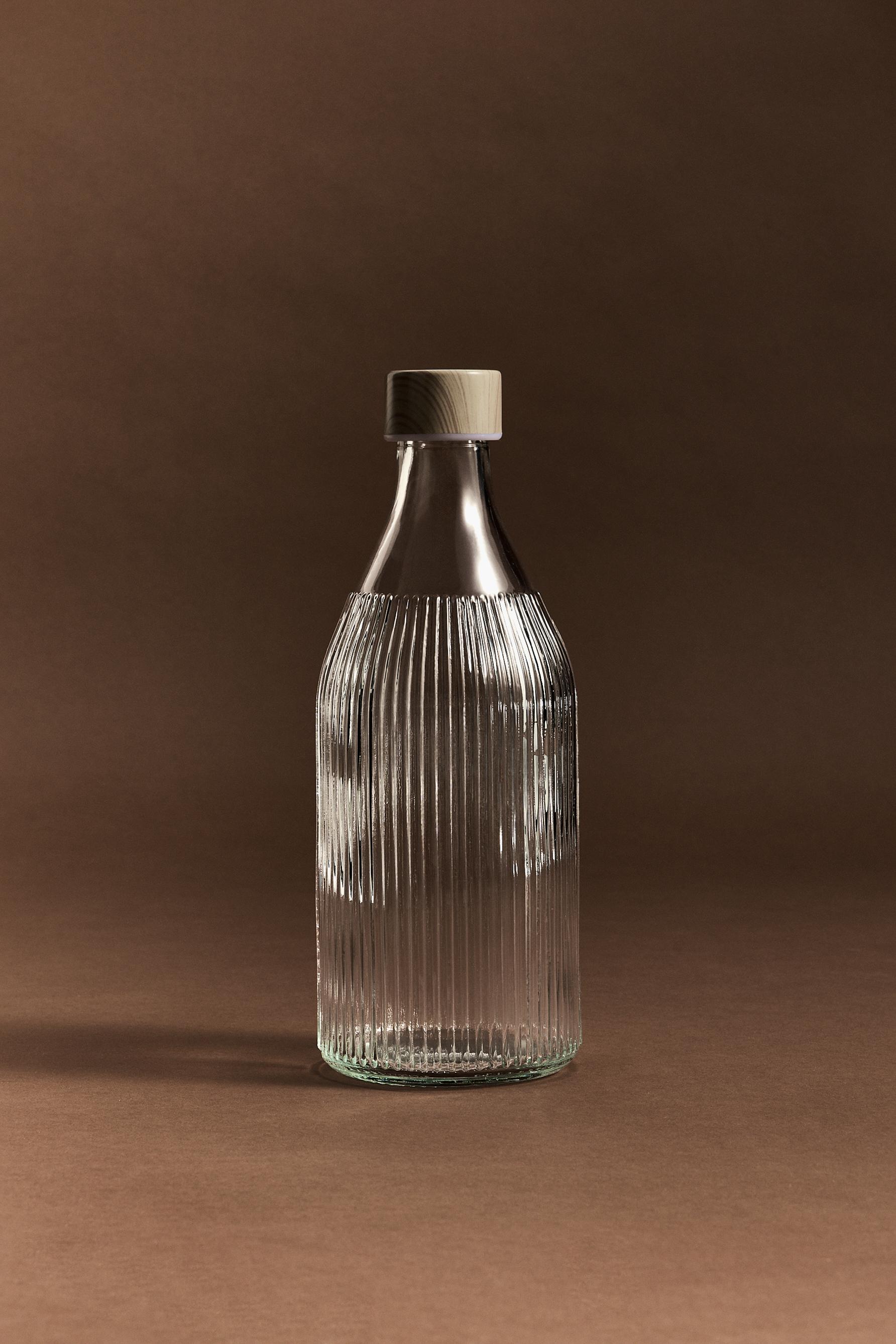 Botella vidrio rayado