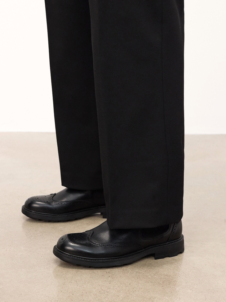 Black leather Chelsea boots with openwork embellishment