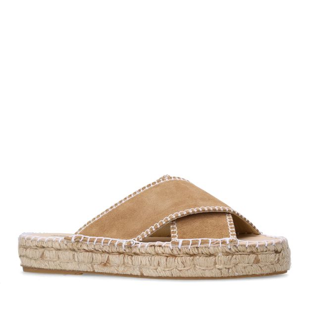 Beige suède slippers met witte stiksels