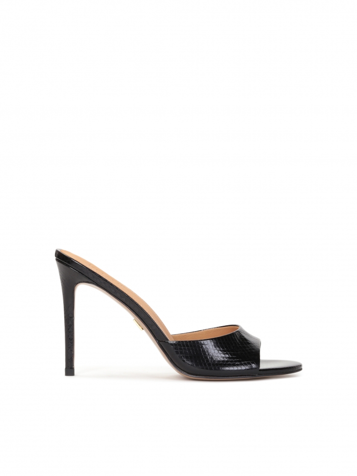 Black mules on a heel made of embossed leather