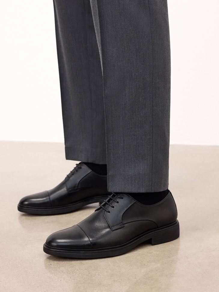 Black shoes with overlapping toes