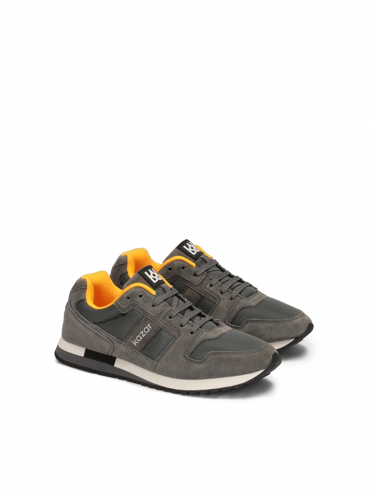 Grey suede sneakers with yellow elements