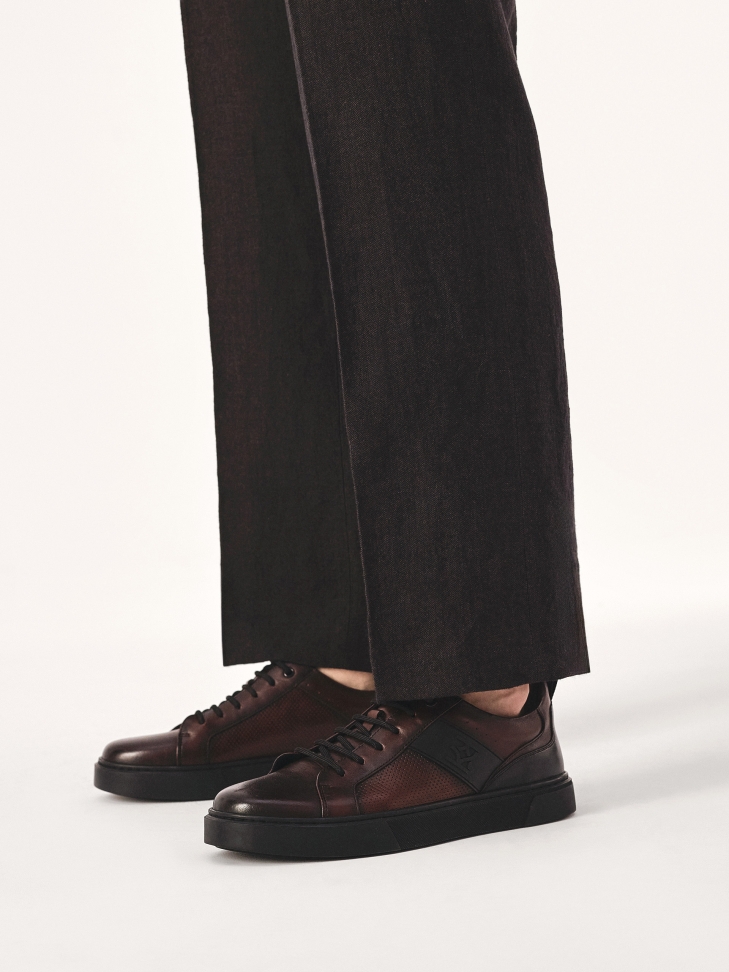 Maroon sneakers with perforated upper