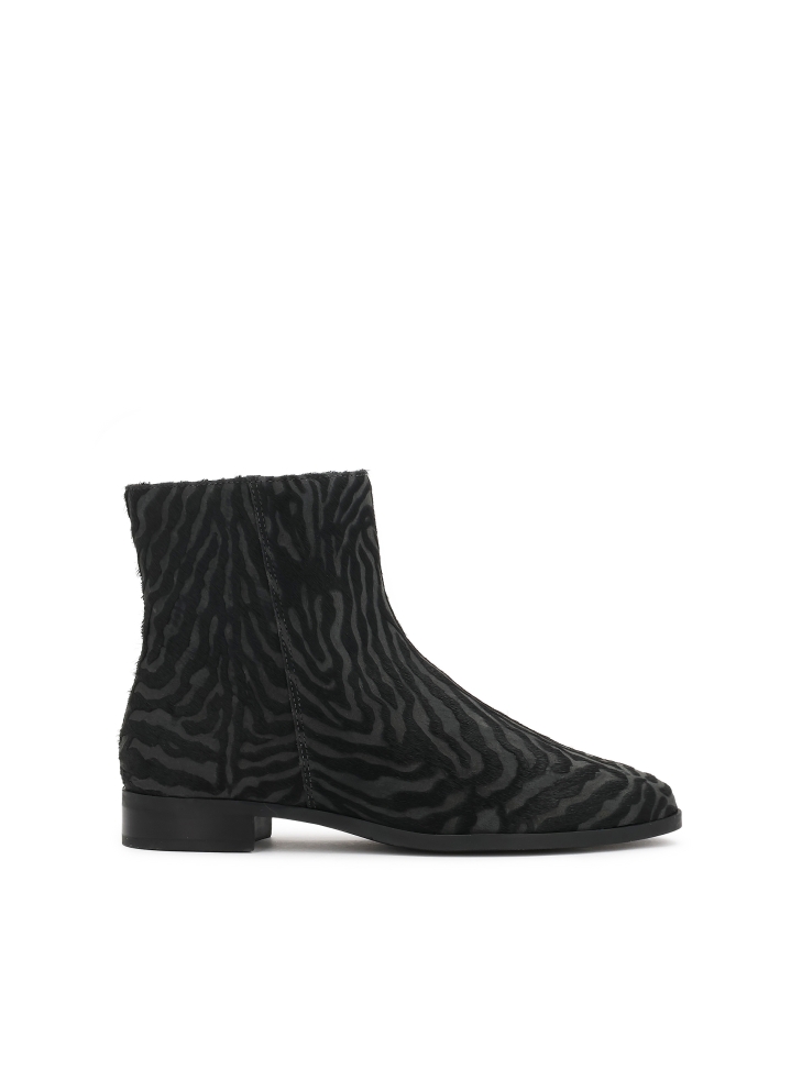 Patterned leather boots with natural hair finish