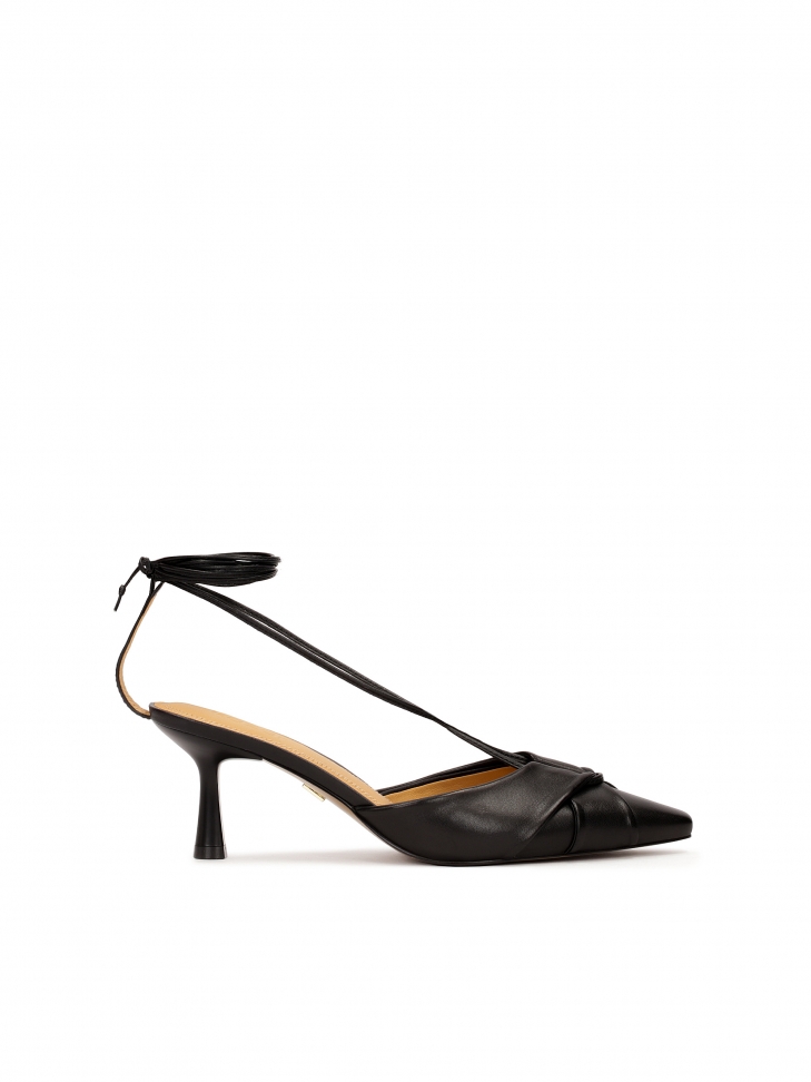 Black pumps with binding around the ankle