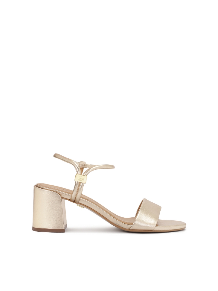 Gold sandals with unique fastening