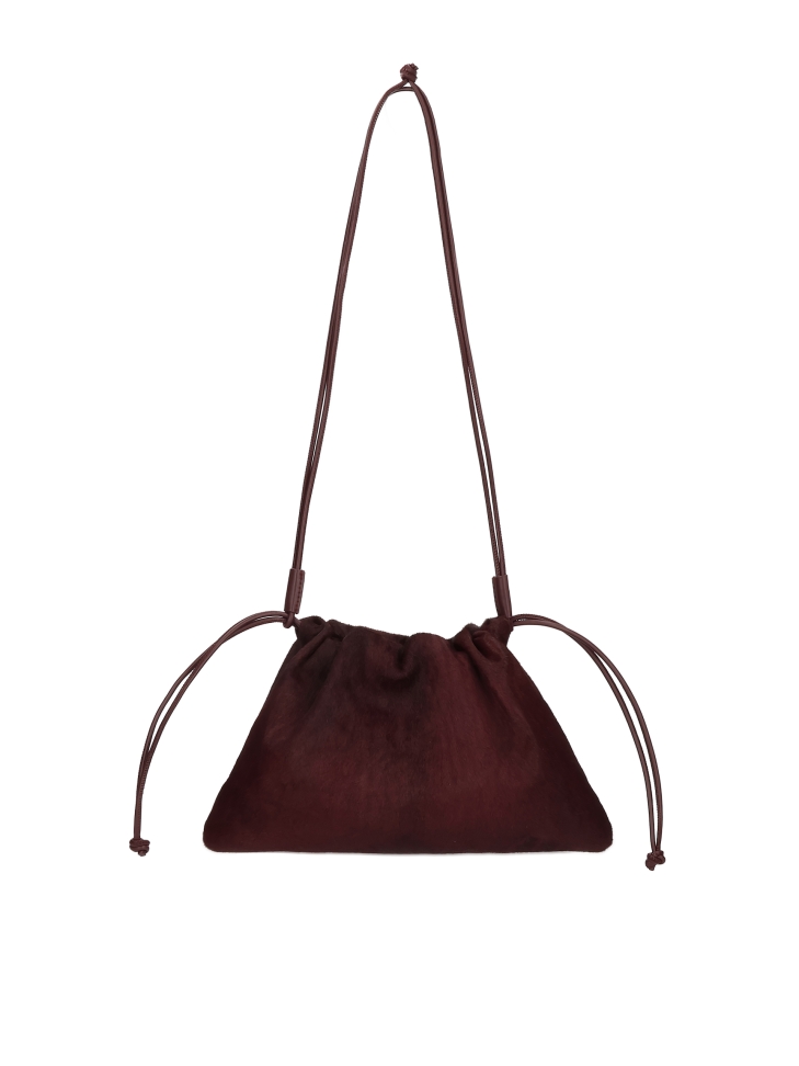 Maroon leather bag with natural bristles