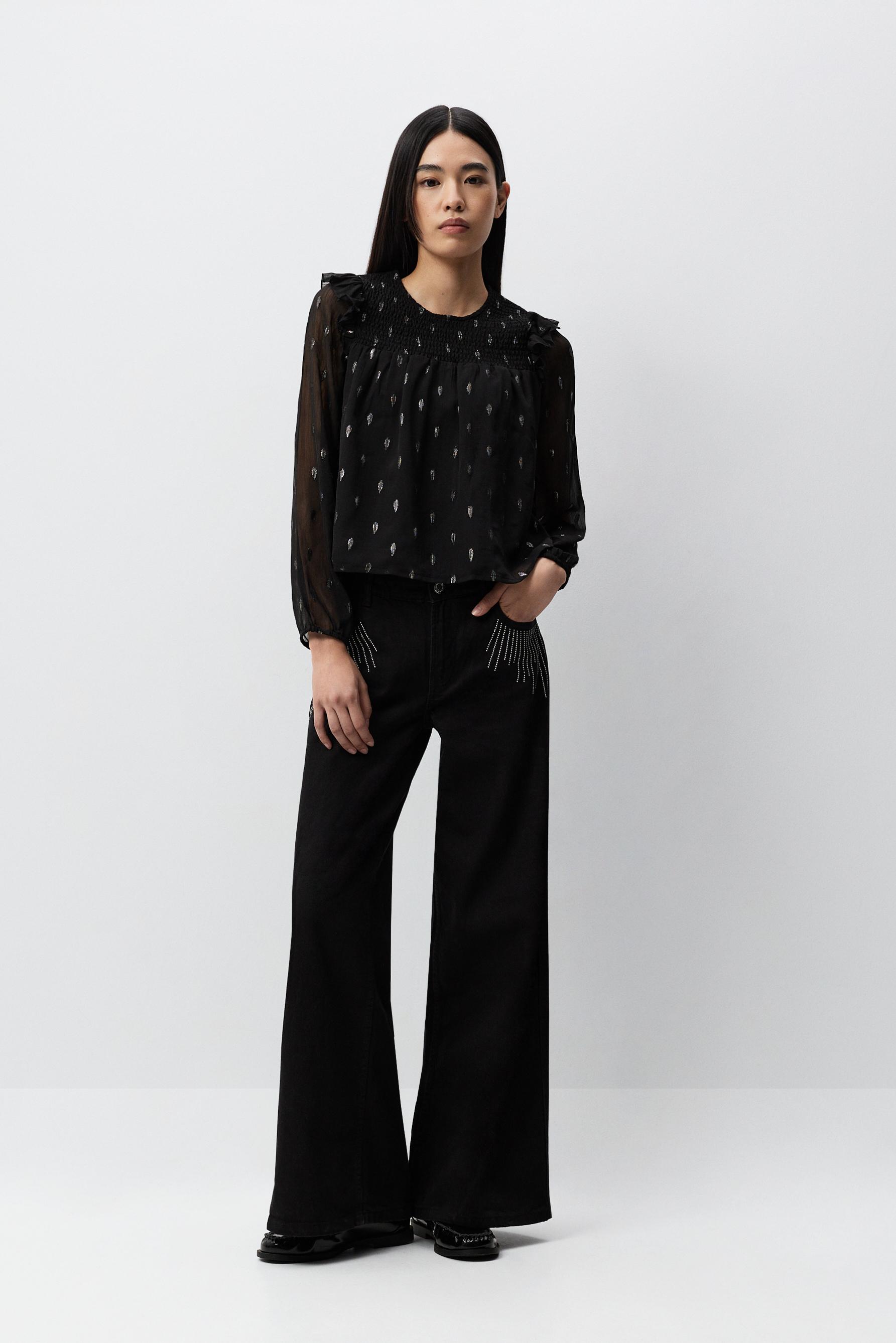Blusa detalles metalizados