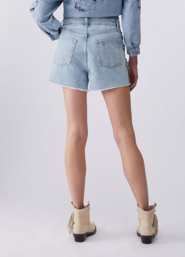 Short in denim con ricami gioiello