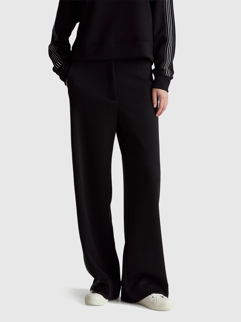Wide trousers with side stripes