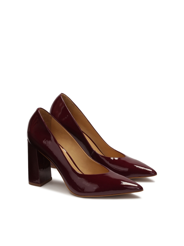 Maroon patent leather pumps with a wide heel