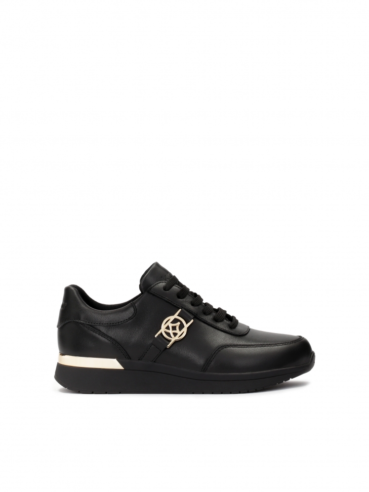 Black leather sneakers decorated with gold elements