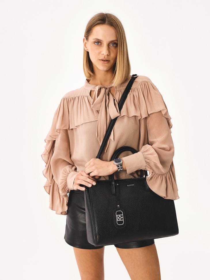 Capacious leather handbag in business style