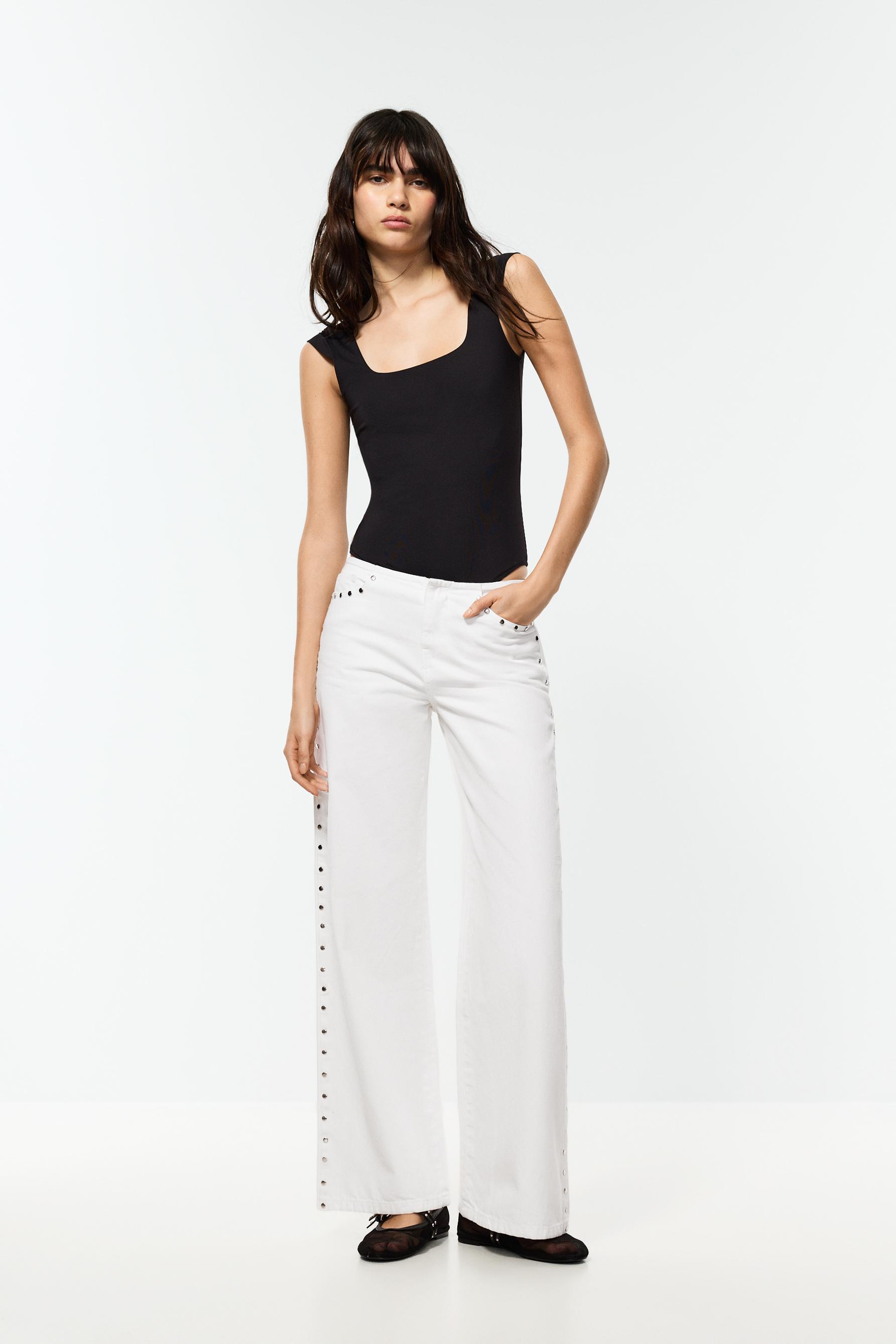 Jeans wide leg sin cintura tachas