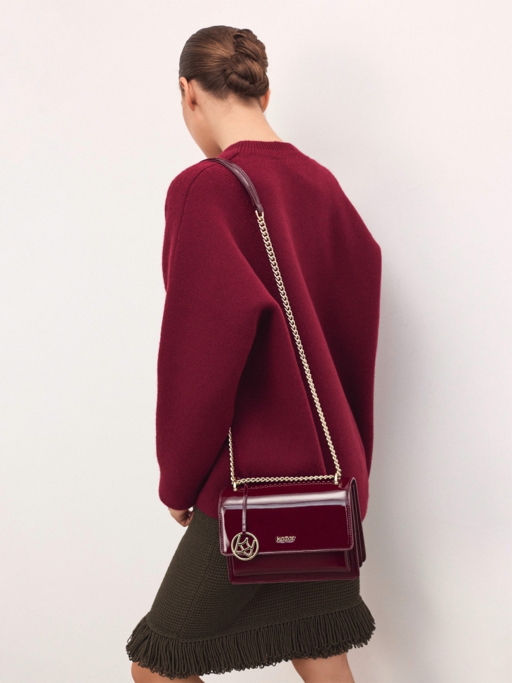 Maroon patent leather handbag
