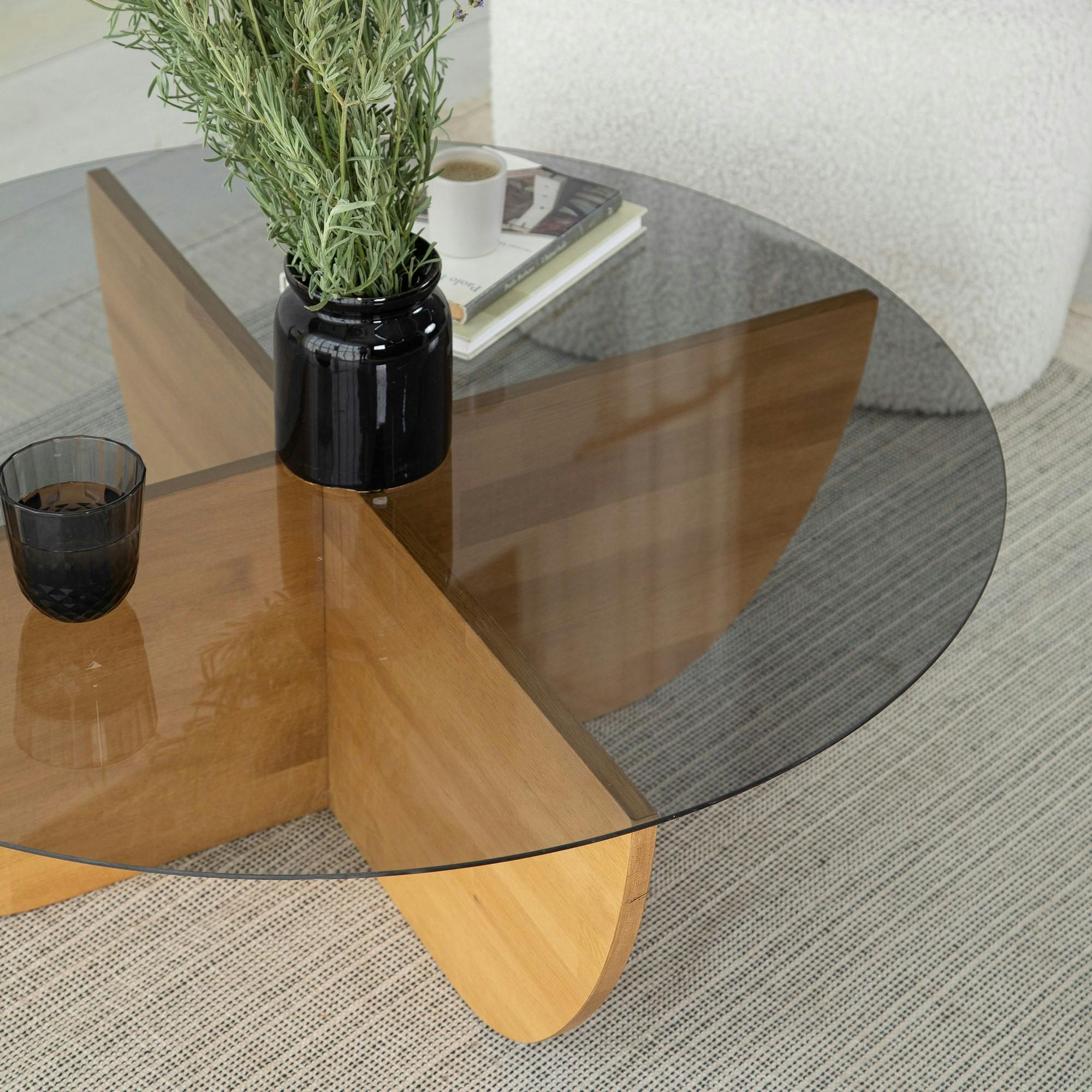 Table basse verre fumé – pied croix bois clair, 90 cm ANZIO