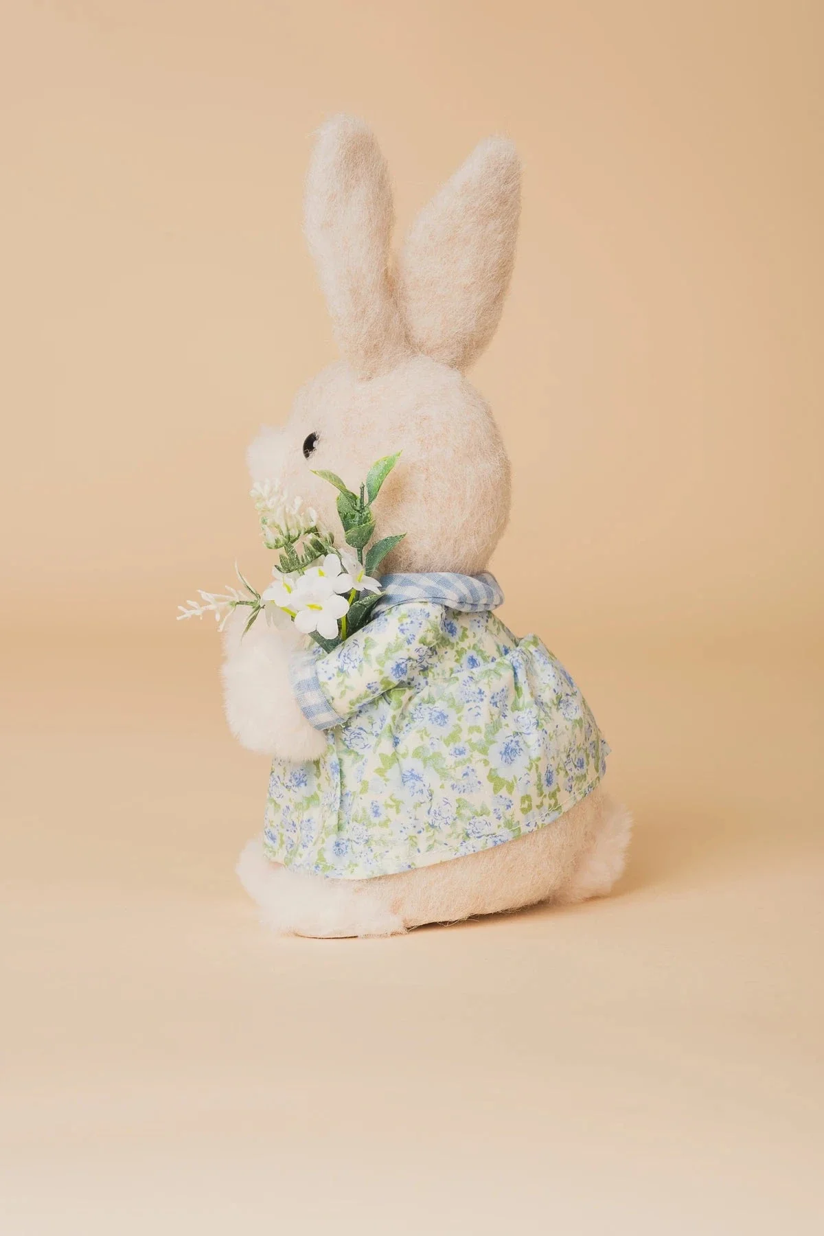 Blue Easter Bunny Girl Holding Flowers