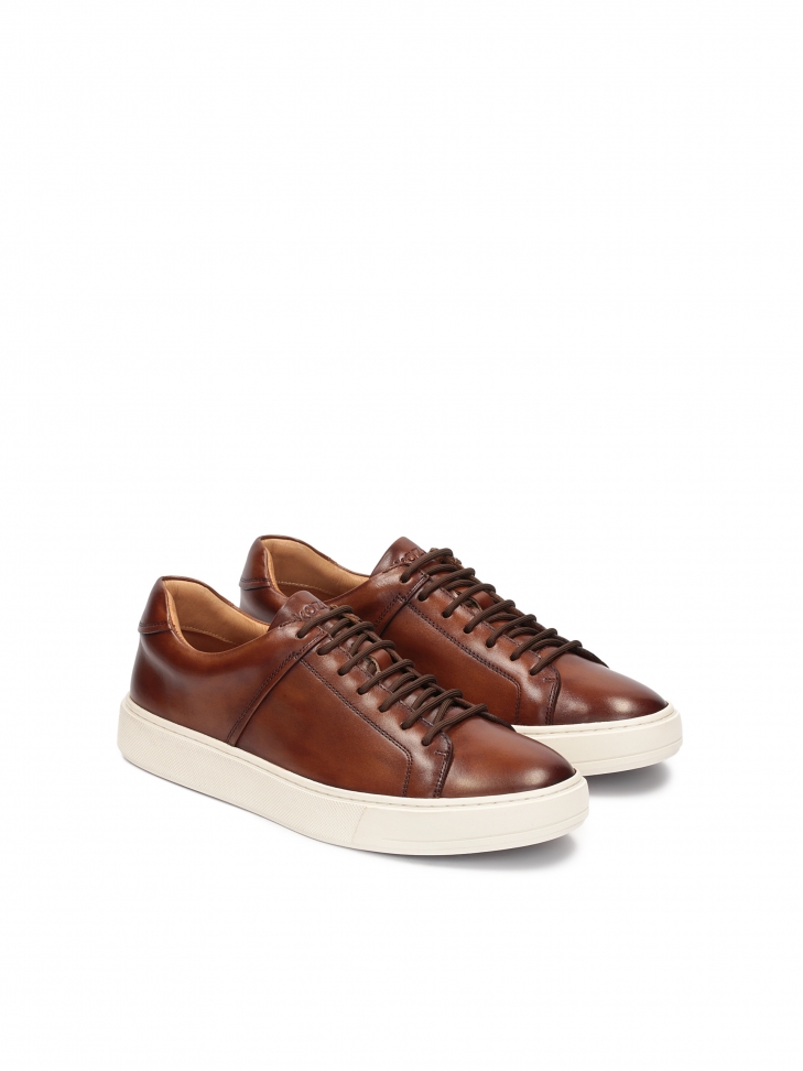 Men's brown sneakers on a white sole