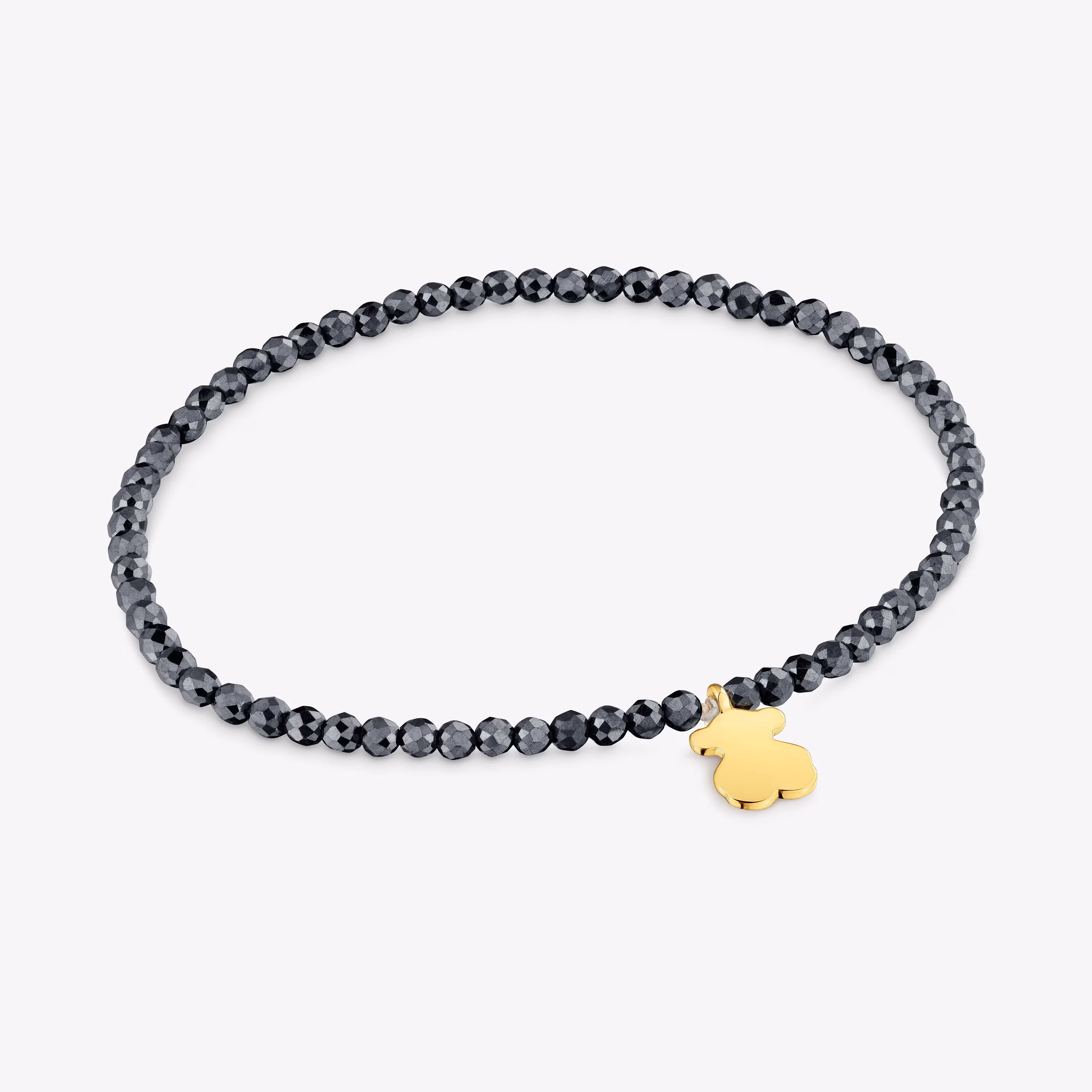 Pulsera elástica con hematita y oso con baño de oro 18 kt sobre plata TOUS Motivos