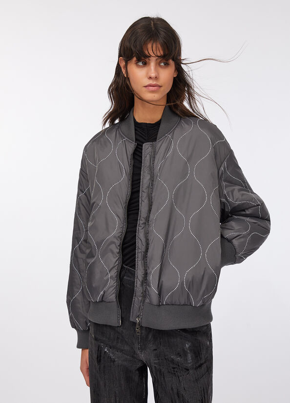 Bomber in nylon con borchie