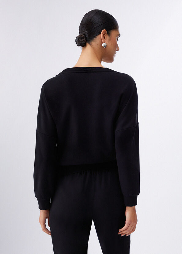 Felpa con applicazioni