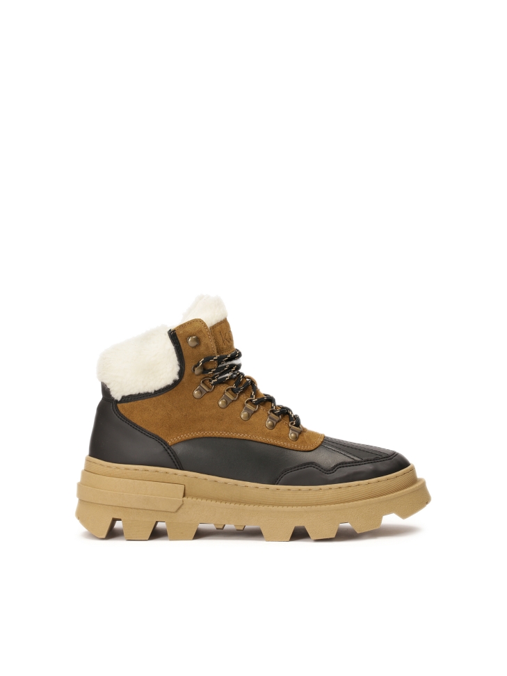 Brown and black boots inspired by snow boots with thick soles