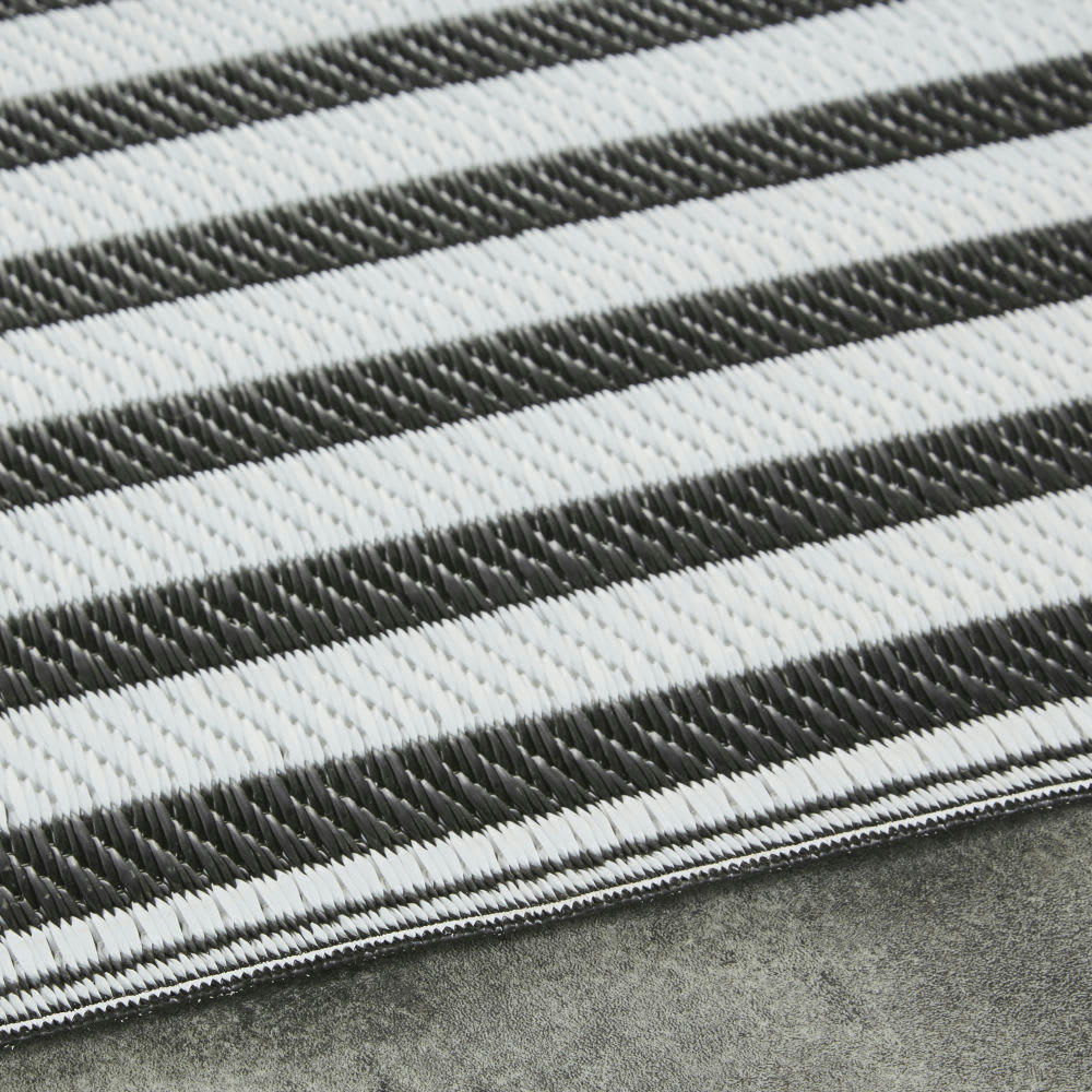 BAHIA - Tapis en polypropylène tissé motifs à rayures noires et blanches 120x180
