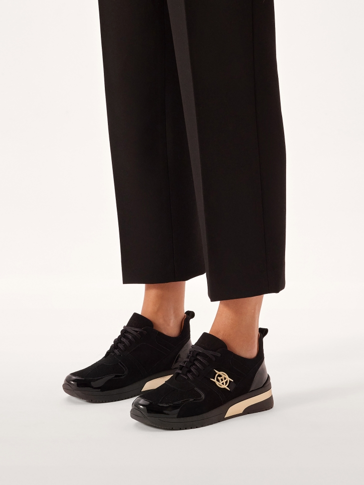 Sneakers made of combined materials on a raised sole