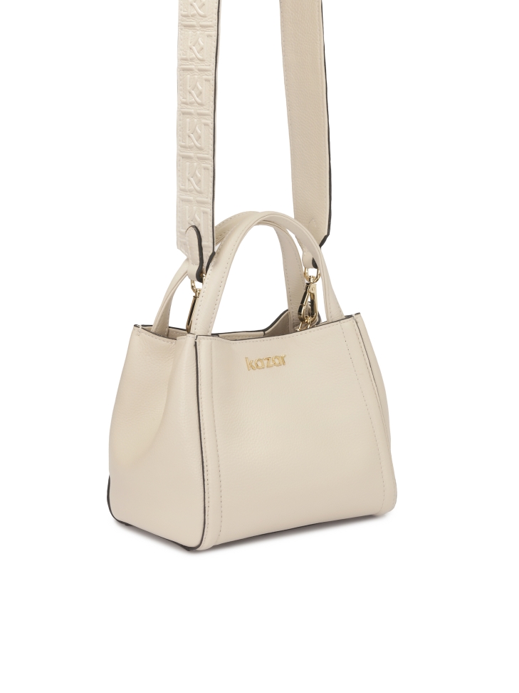Soft cream handbag with monogram embossed strap