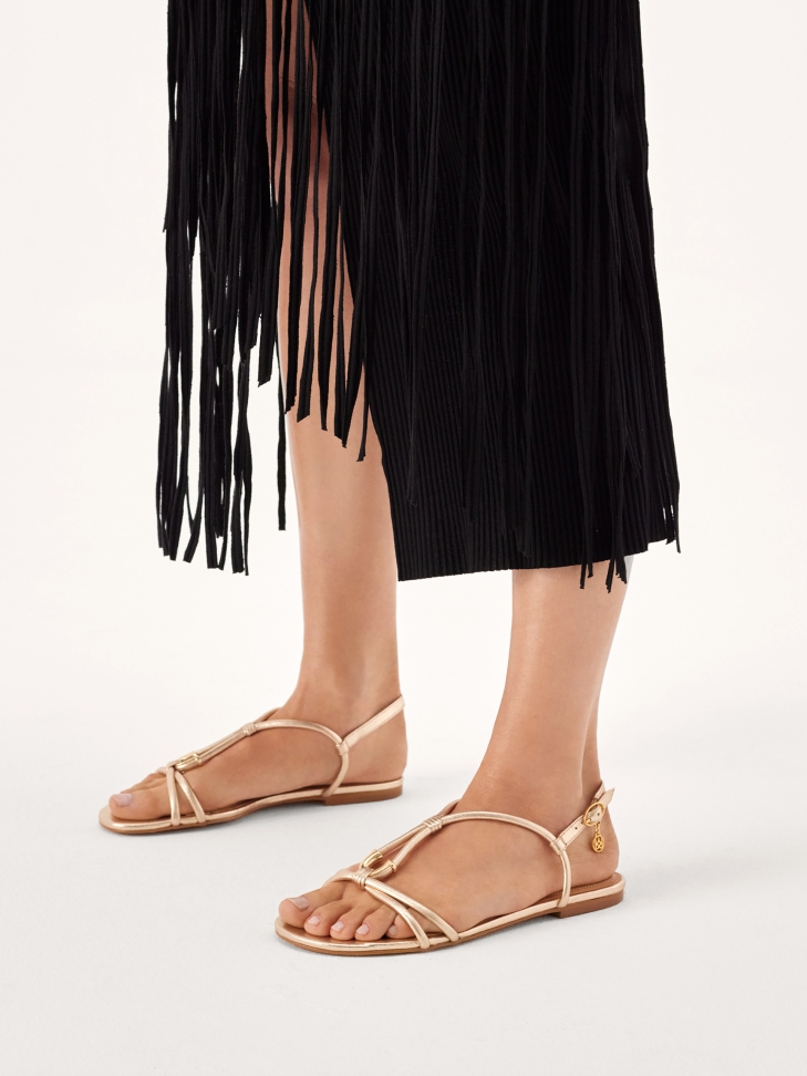 Comfortable gold sandals with metal embellishment