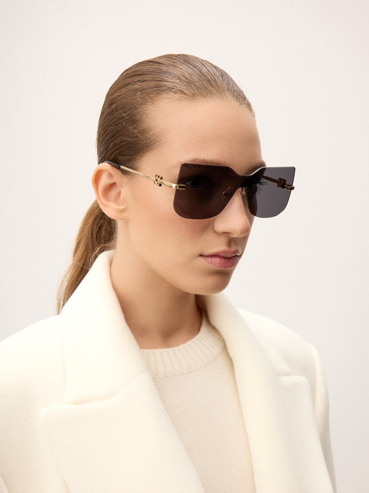 Frameless glasses with gold temples