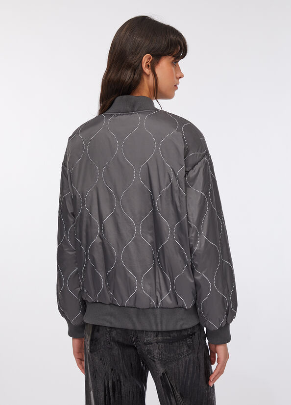 Bomber in nylon con borchie