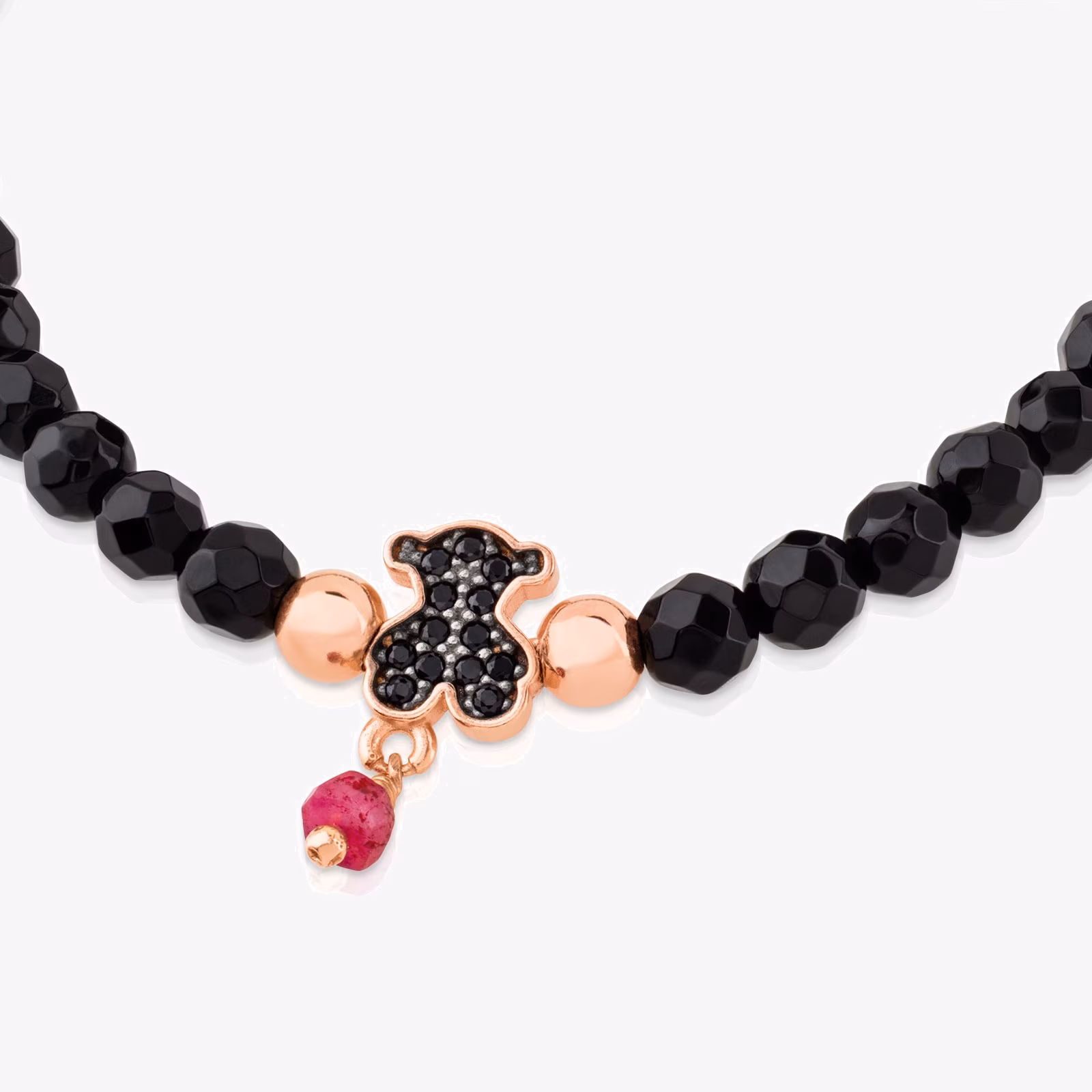 Pulsera con baño de oro rosa 18 kt sobre plata, espinelas y ónix facetado motivo oso Motif