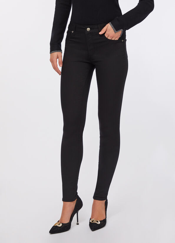 Pantaloni skinny a vita alta