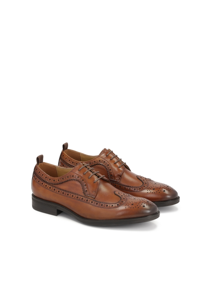 Brown leather shoes with rosette decoration
