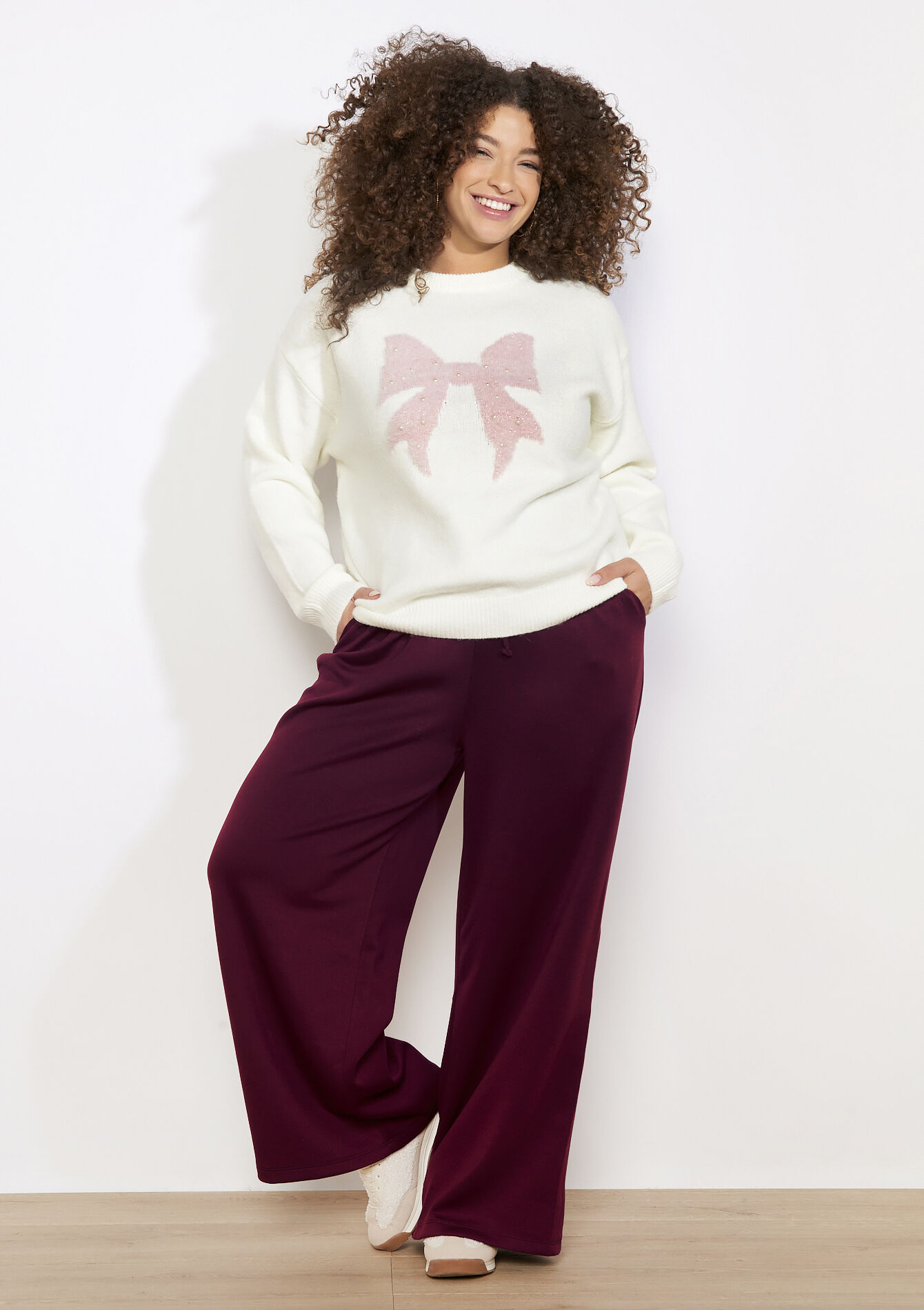 Trui met paillettenstrik