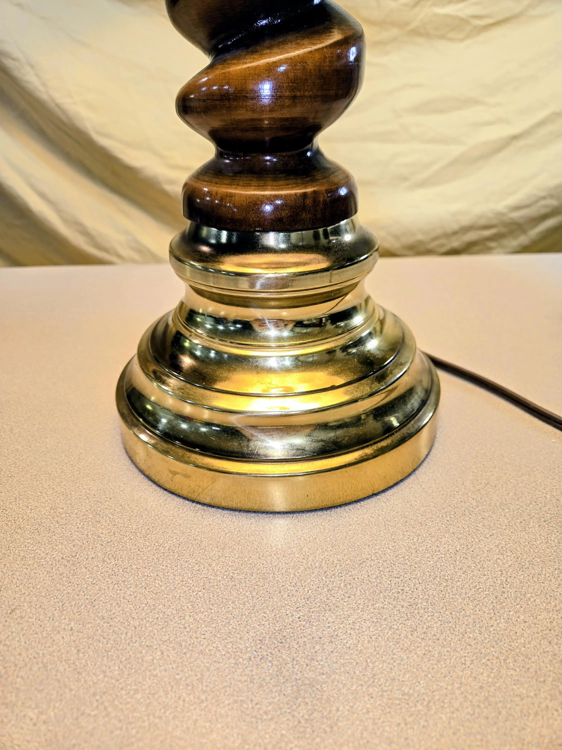 Vintage mid century carved wood spiral shaft and brass base.