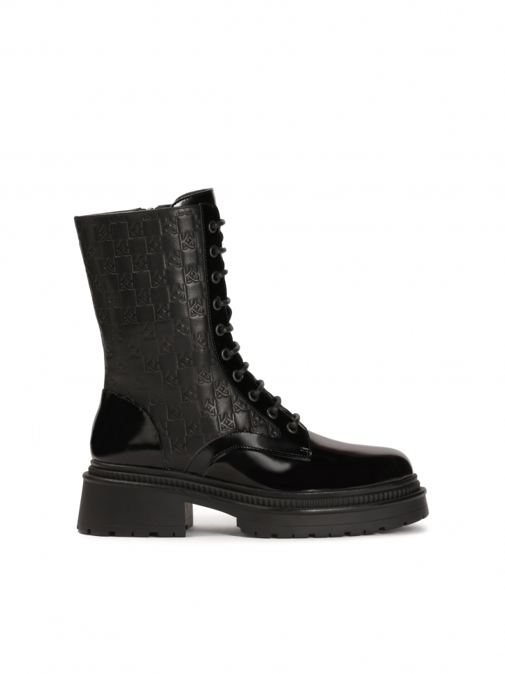 Black boots with embossed pattern on leather