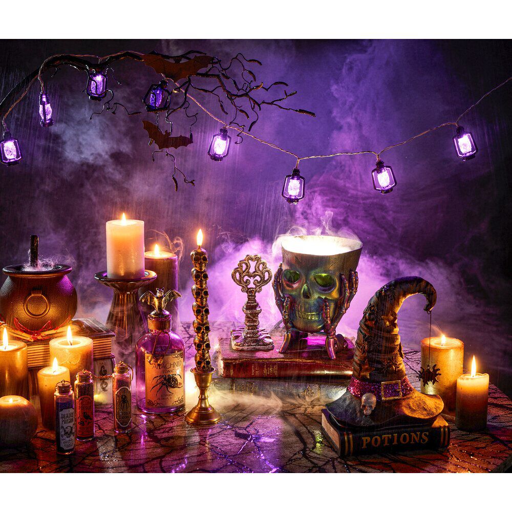 Bougie cire à LED Halloween crânes empilés noir Ø2,5xH25cm