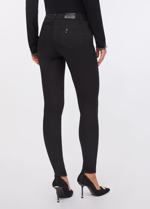 Pantaloni skinny a vita alta