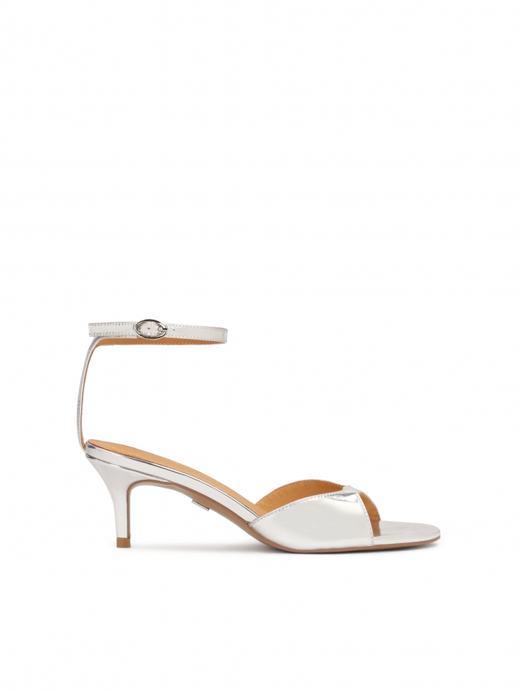 Silver sandals with a strap at the heel