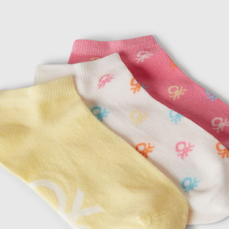 Three pairs of socks with logos