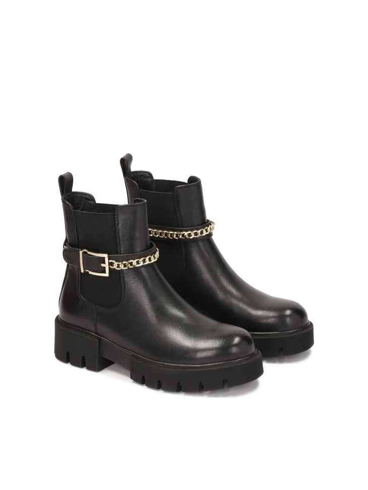 Chelsea boots with decorative belt and chain