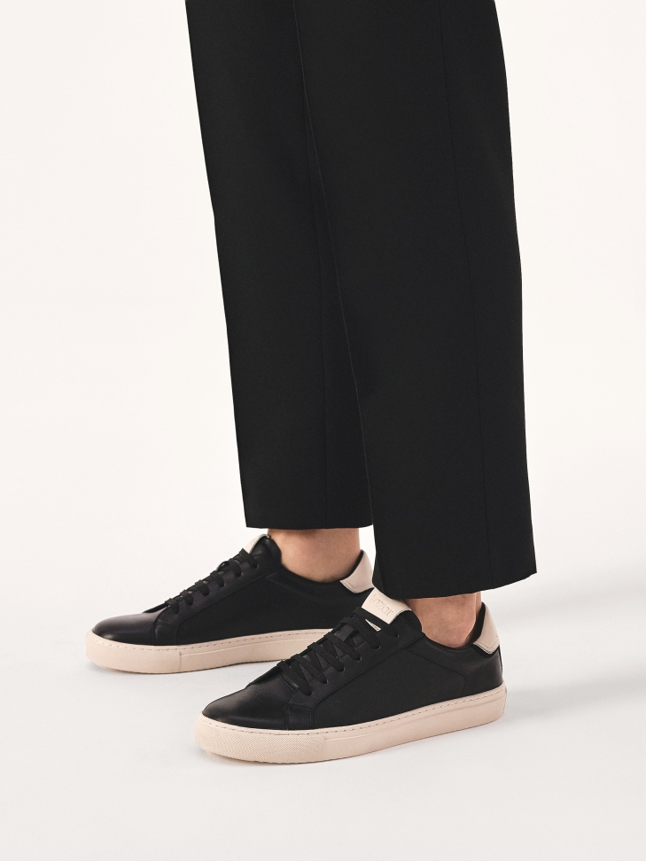 Black sneakers with contrasting sole