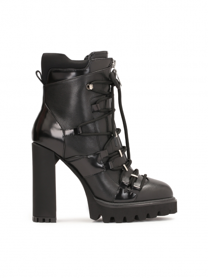 Avant-garde booties with decorative lacing