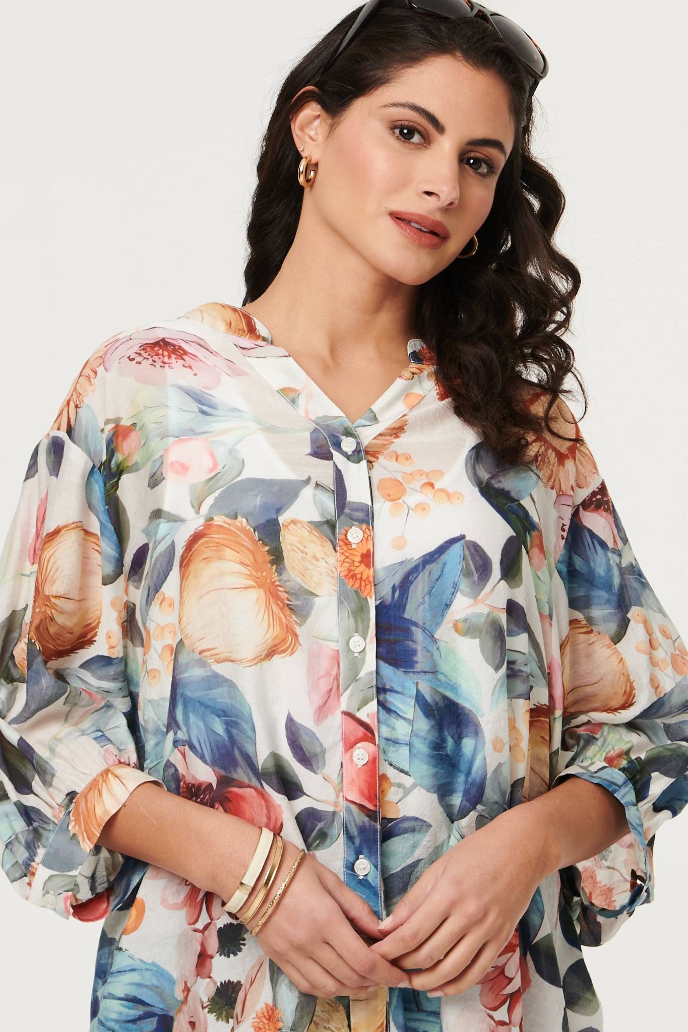Izabel London Abstract Floral Curve Hem Blouse