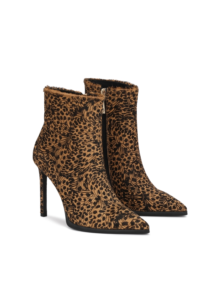 Patterned leather boots with natural hair finish