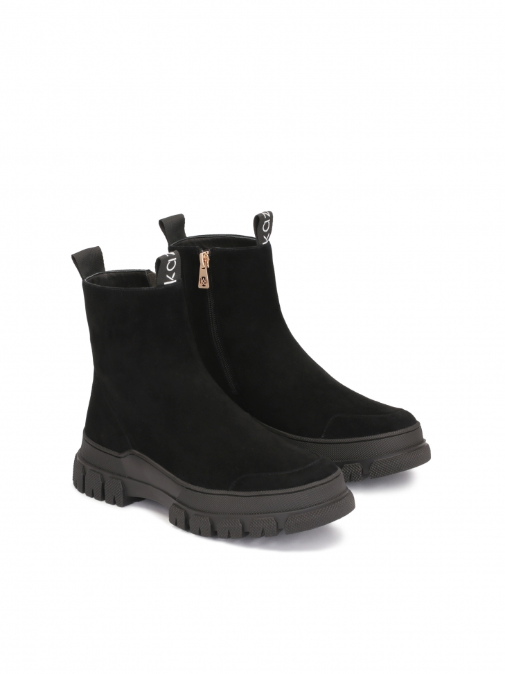 Suede flat ankle boots with an overlay on the toe and the heel