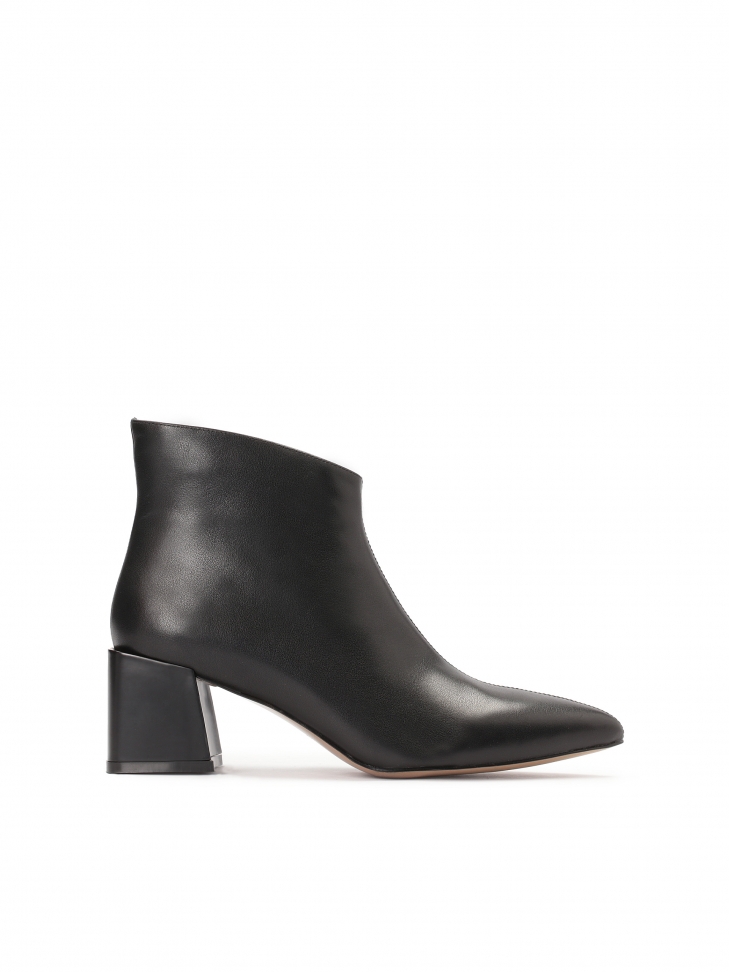 Black leather booties on a trendy protruding heel