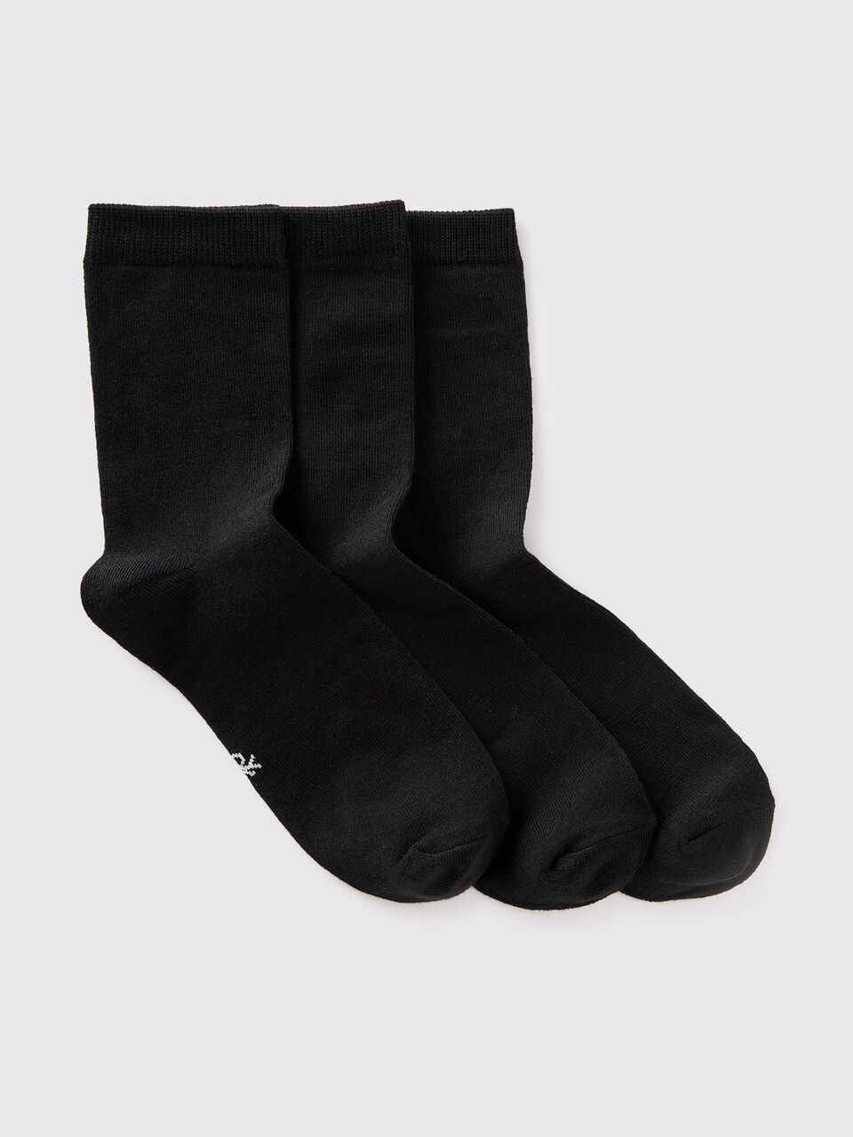 Three pairs of solid-colored medium socks
